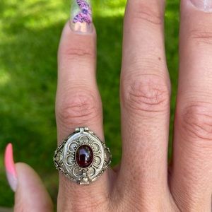 Poison ring with red gemstone